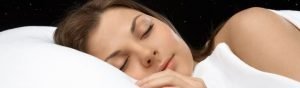 Woman sleeping on the best mattress for side sleepers .