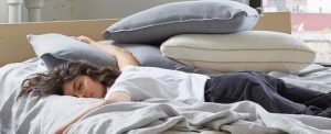 Woman Sleeping on the Keetsa Mattress and Topper.