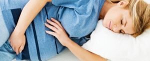 Woman Sleeping in a Maternity Belt.