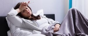 Woman Sleeping With a Fever.