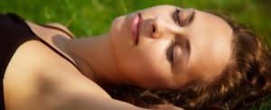 Woman sleeping with sunburn.