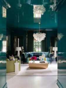 Modern luxury interior featuring high-gloss teal wall panels, contemporary furniture, and reflective finishes that enhance light and depth.