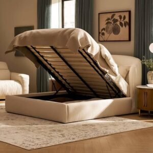 Modern beige ottoman storage bed with a gas-lift mechanism raised to reveal spacious under-bed storage in a bright contemporary bedroom.
