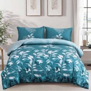 Blue floral bed sheet and comforter set with matching pillowcases in a modern bedroom featuring botanical patterns and soft contemporary décor.