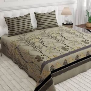 Beige botanical bed sheet set with brown floral branch patterns and matching striped pillowcases on a white upholstered bed in a modern bedroom.